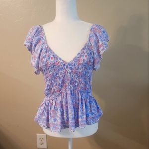 Womens strech top a little longer in back. Sleeve can be on or off shoulder